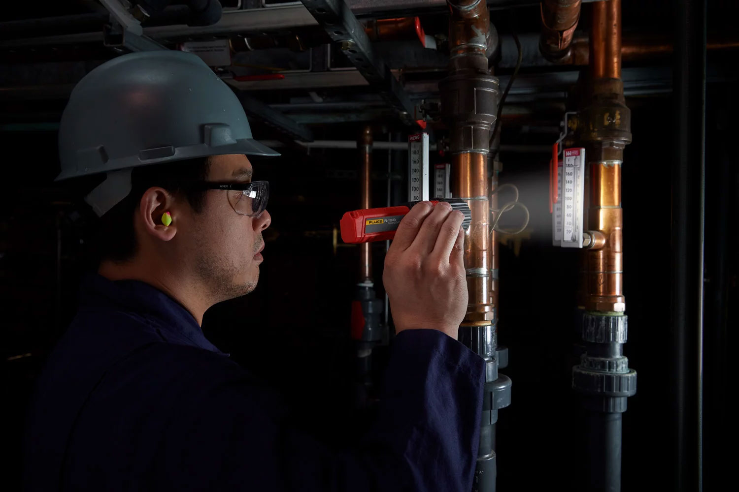The Fluke FL-150 EX Intrinsically Safe Flashlight in use a dark area